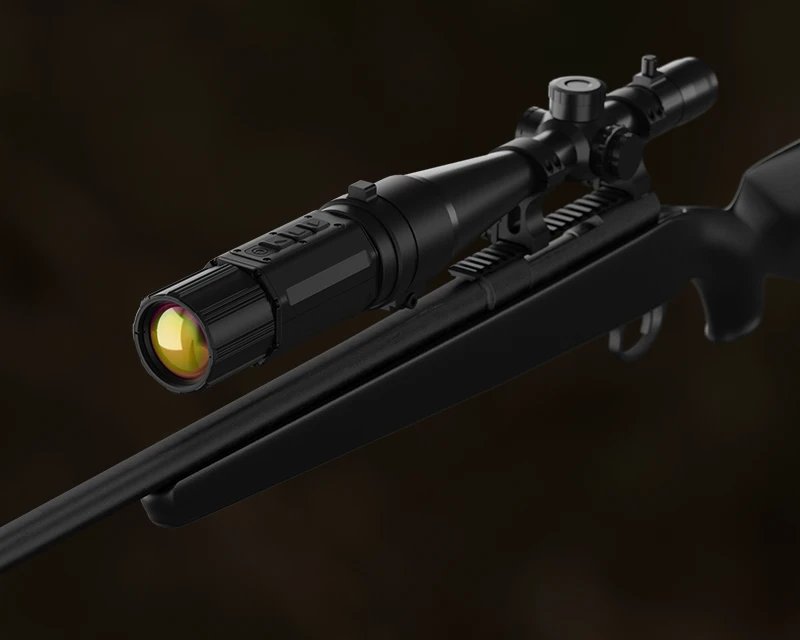 Hunter in the field using an ATN thermal clip-on at dusk