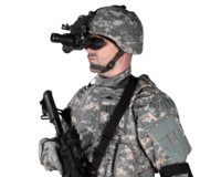 Hunter aiming a rifle fitted with an ATN X-Sight 5 day and night scope at dusk
