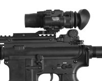 Hunter scanning at night with an ATN thermal optic in the field