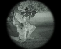 Hunter in the field using an ATN scope at dusk