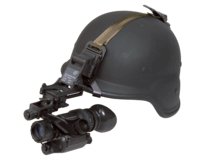 Hunter scanning at night with an ATN thermal optic in the field
