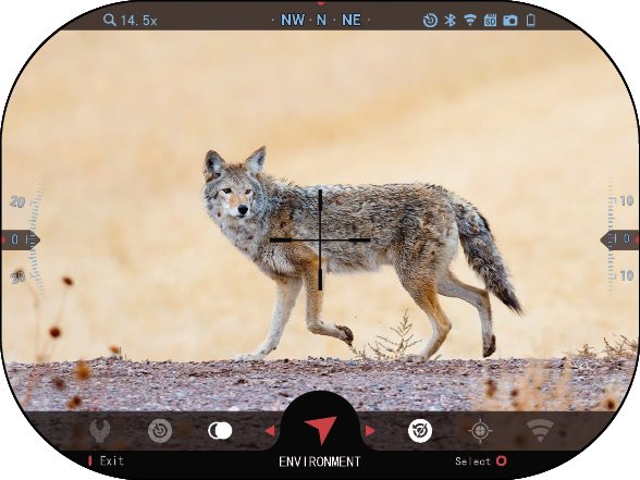 Iron hot thermal view of a coyote in an open field through an ATN thermal optic